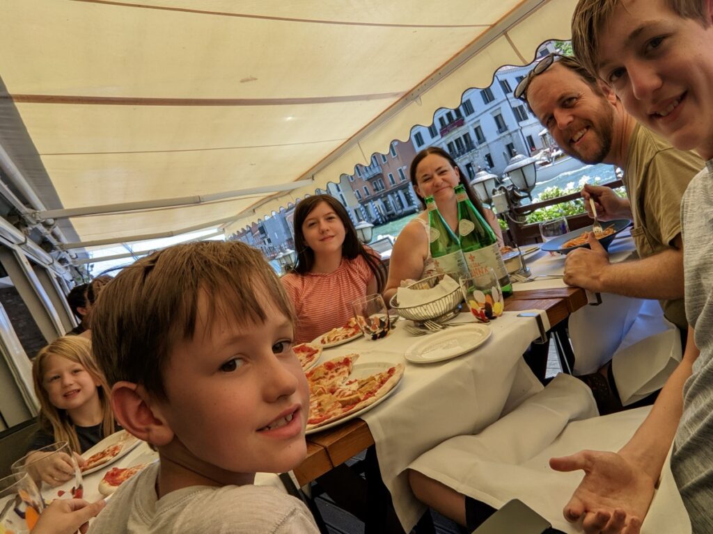 Eating by canal in Venice